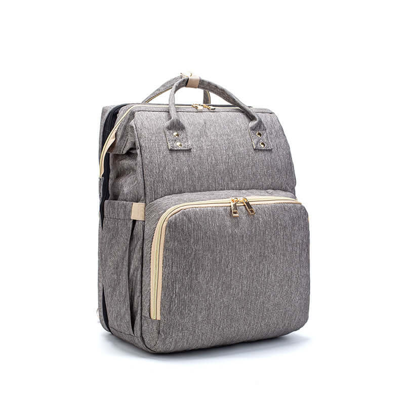 Sac à dos pliable multifonction avec chargeur USB, idéal pour les mamans en déplacement.