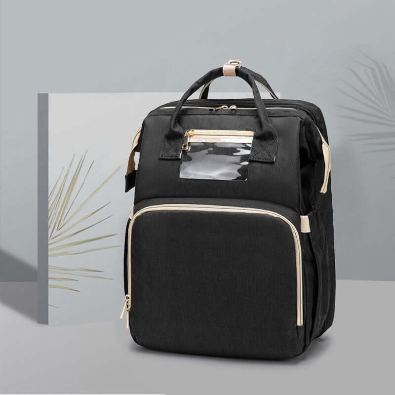 Sac à dos pliable multifonction noir avec chargeur USB, idéal pour les mamans en déplacement.